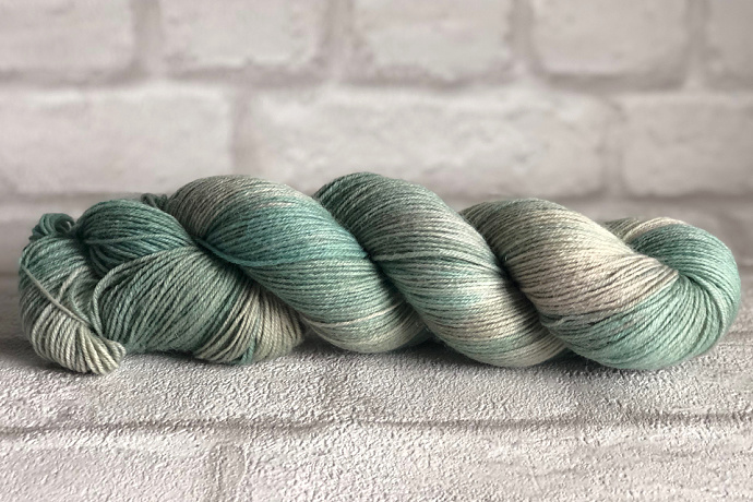 Folklore - Hand dyed sock yarn - grey and moss green speckled assigned